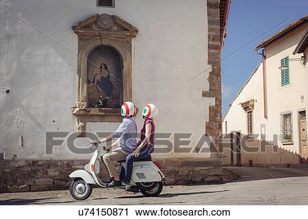 Couple looking at church painting from moped, Florence, Italy View Large Photo Image Stock Image - Couple looking at church painting from moped, Florence, Italy. Fotosearch