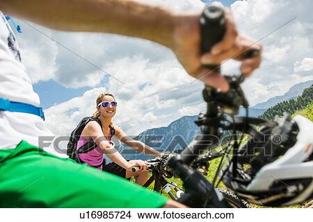 Picture - Couple on mountain bikes, Tyrol, Austria. Fotosearch