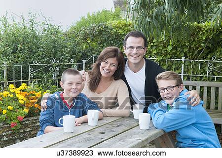 Family portrait at picnic bench View Large Photo Image Stock Image - Family portrait at picnic bench. Fotosearch