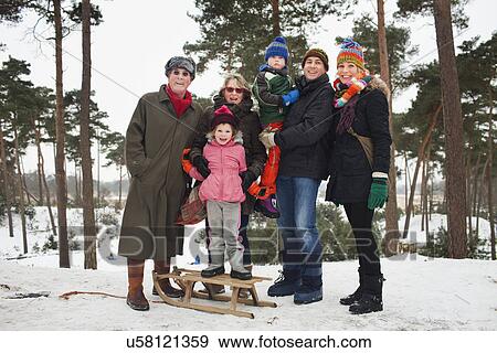 Stock Photo - Family portrait of three generations in winter scene. Fotosearch
