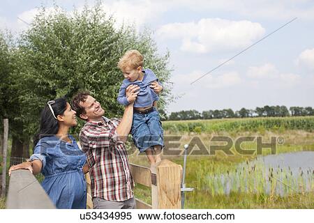 Family walking through countryside View Large Photo Image Stock Photography - Family walking through countryside. Fotosearch