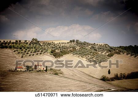 Stock Image - Farmhouse in field, Siena, Valle Orcia, Tuscany, Italy. Fotosearch