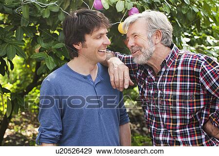 Father and adult son together View Large Photo Image Stock Photo - Father and adult son together. Fotosearch