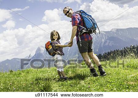 Father and daughter holding hands, Tyrol, Austria View Large Photo Image Picture - Father and daughter holding hands, Tyrol, Austria. Fotosearch