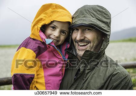 Father and daughter in rainproof jackets View Large Photo Image Stock Photo - Father and daughter in rainproof jackets. Fotosearch