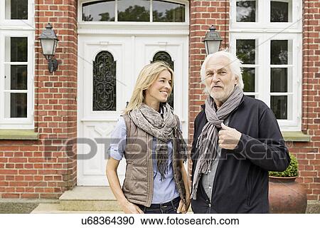 Father and daughter outside house View Large Photo Image Stock Image - Father and daughter outside house. Fotosearch