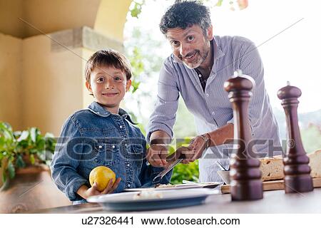 Father and son preparing food View Large Photo Image Stock Image - Father and son preparing food. Fotosearch