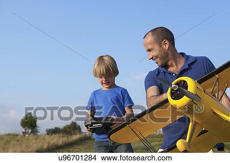 Father and son preparing model plane View Large Photo Image Picture - Father and son preparing model plane. Fotosearch