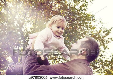 Father lifting toddler View Large Photo Image Stock Photography - Father lifting toddler. Fotosearch