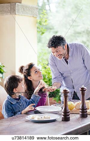 Father showing ingredients to son and daughter View Large Photo Image Stock Photo - Father showing ingredients to son and daughter. Fotosearch