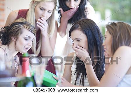 Female friends giving birthday gift View Large Photo Image Stock Photo - Female friends giving birthday gift. Fotosearch