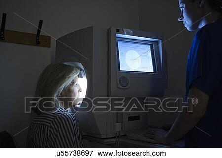 Female patient having eye examination in hospital View Large Photo Image Stock Photo - Female patient having eye examination in hospital. Fotosearch