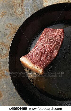 Fillet of meat in frying pan View Large Photo Image Stock Photo - Fillet of meat in frying pan. Fotosearch