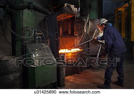 Flight bar (mining component) having been forged in big hammer, is levered off the counterblow hammer, in order to move to clipping press View Large Photo Image Stock Image - Flight bar (mining component) having been forged in big hammer, is levered off the counterblow hammer, in order to move to clipping press. Fotosearch