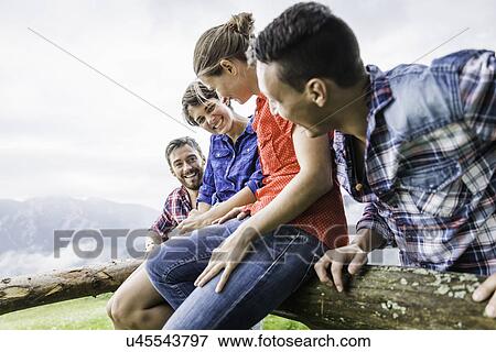 Four friends having fun, Tyrol Austria View Large Photo Image Stock Photo - Four friends having fun, Tyrol Austria. Fotosearch