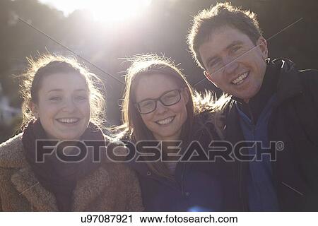 Friends on day trip in Devon, UK wearing winter clothing View Large Photo Image Stock Image - Friends on day trip in Devon, UK wearing winter clothing. Fotosearch
