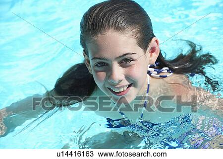 Girl in swimming pool View Large Photo Image Stock Image - Girl in swimming pool. Fotosearch