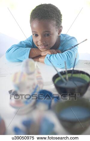 Stock Photography - Girl pleased with her artwork. Fotosearch