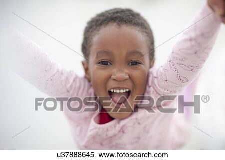 Girl raising arms in excitement View Large Photo Image Stock Photography - Girl raising arms in excitement. Fotosearch