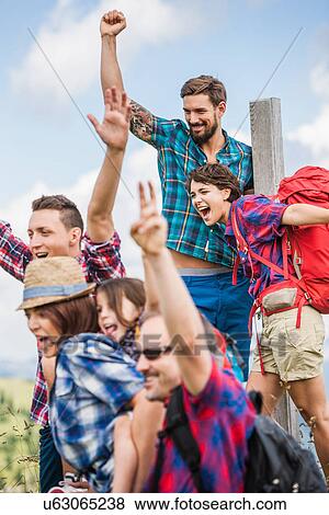 Group of friends cheering View Large Photo Image Stock Photo - Group of friends cheering. Fotosearch