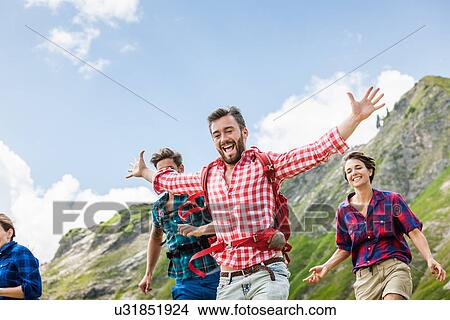 Group of friends hiking, Tyrol, Austria View Large Photo Image Picture - Group of friends hiking, Tyrol, Austria. Fotosearch