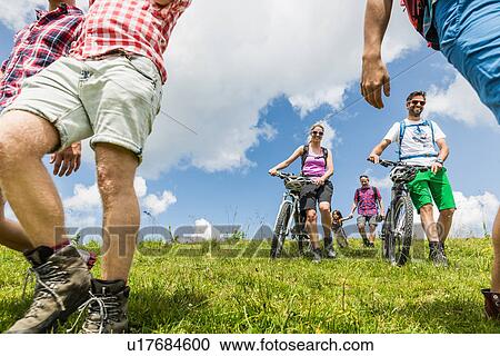 Stock Image - Group of friends hiking, Tyrol, Austria. Fotosearch
