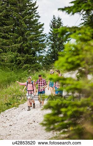Group of friends hiking, Tyrol, Austria View Large Photo Image Stock Image - Group of friends hiking, Tyrol, Austria. Fotosearch