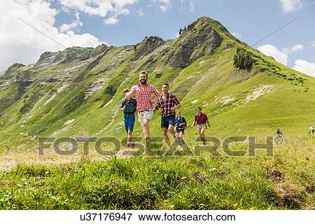 Stock Photo - Group of friends hiking, Tyrol, Austria. Fotosearch