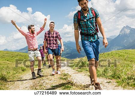 Stock Photo - Group of friends hiking, Tyrol, Austria. Fotosearch