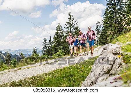 Stock Photography - Group of friends hiking, Tyrol, Austria. Fotosearch