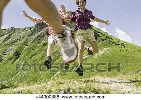 Group of friends jumping, Tyrol, Austria View Large Photo Image Stock Photo - Group of friends jumping, Tyrol, Austria. Fotosearch