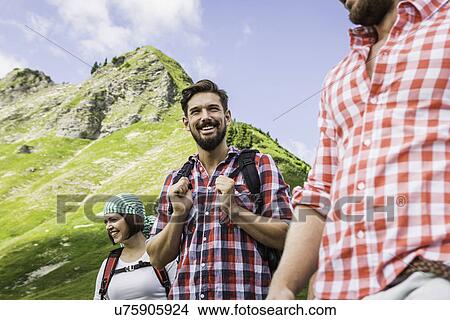 Picture - Group of friends on hike, Tyrol, Austria. Fotosearch