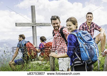 Stock Photo - Group of friends on hike, Tyrol, Austria. Fotosearch
