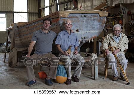 Group portrait of three generations of male boat builders View Large Photo Image Stock Photo - Group portrait of three generations of male boat builders. Fotosearch