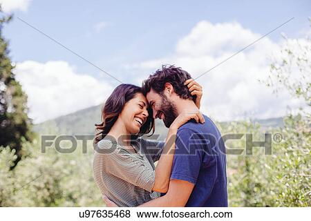 Happy mid adult couple outdoors View Large Photo Image Stock Photo - Happy mid adult couple outdoors. Fotosearch