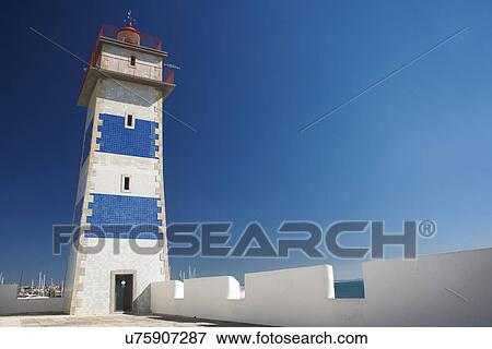 Stock Photo - Harbor lighthouse, Lisbon, Portugal. Fotosearch