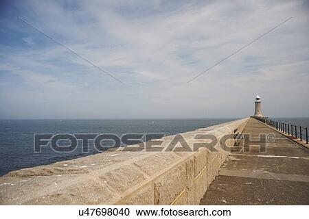 Harbour wall and lighthouse, Tynemouth, Tyne and Wear, United Kingdom View Large Photo Image Stock Image - Harbour wall and lighthouse, Tynemouth, Tyne and Wear, United Kingdom. Fotosearch