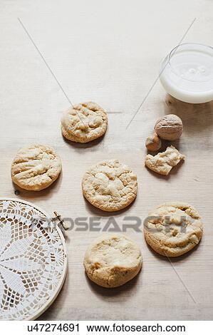 Stock Image - Hazelnut cookies and milk. Fotosearch
