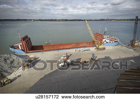 High angle view of crane loading bulk cargo ship at river port View Large Photo Image Stock Image - High angle view of crane loading bulk cargo ship at river port. Fotosearch