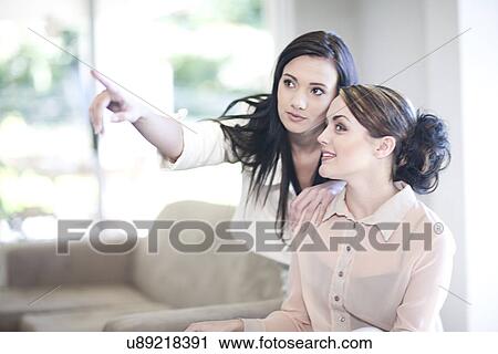 Interior designer advising client at home View Large Photo Image Stock Image - Interior designer advising client at home. Fotosearch