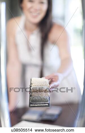 Interior designer holding up textile swatches View Large Photo Image Picture - Interior designer holding up textile swatches. Fotosearch