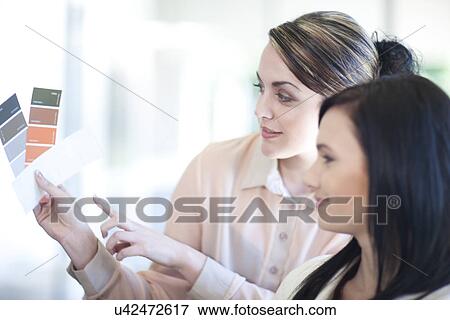 Interior designer showing client color swatch View Large Photo Image Stock Photo - Interior designer showing client color swatch. Fotosearch