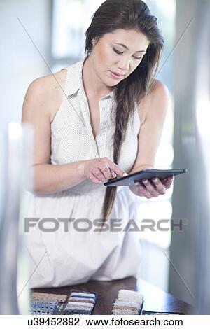 Interior designer using digital tablet View Large Photo Image Stock Image - Interior designer using digital tablet. Fotosearch