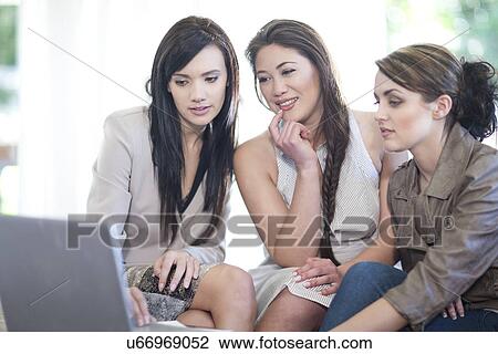 Interior designers and client looking at computer View Large Photo Image Stock Image - Interior designers and client looking at computer. Fotosearch