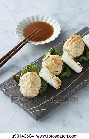 Japanese food served on slate with chopsticks and dipping sauce View Large Photo Image Picture - Japanese food served on slate with chopsticks and dipping sauce. Fotosearch
