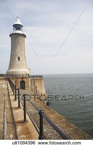 Stock Photograph - Lighthouse and harbor wall, Tynemouth, Tyne and Wear, United Kingdom. Fotosearch