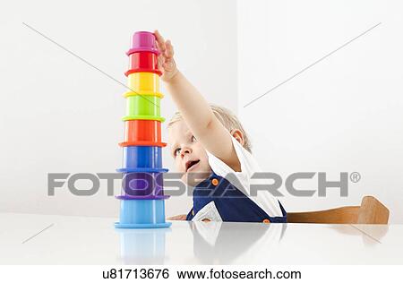 Little boy playing with stacking cups View Large Photo Image Stock Photograph - Little boy playing with stacking cups. Fotosearch