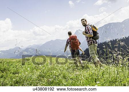 Male friends hiking, Tyrol, Austria View Large Photo Image Stock Image - Male friends hiking, Tyrol, Austria. Fotosearch