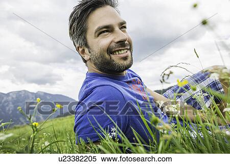 Man enjoying the meadow View Large Photo Image Stock Photography - Man enjoying the meadow. Fotosearch