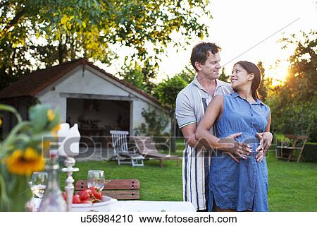 Man hugging pregnant woman, hands on stomach View Large Photo Image Stock Image - Man hugging pregnant woman, hands on stomach. Fotosearch